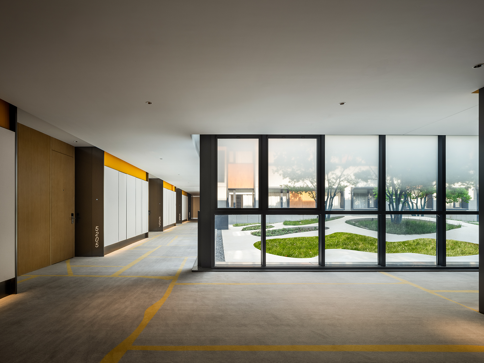 11modern hotel corridor with courtyard view Hotel interior design ideas corridor view