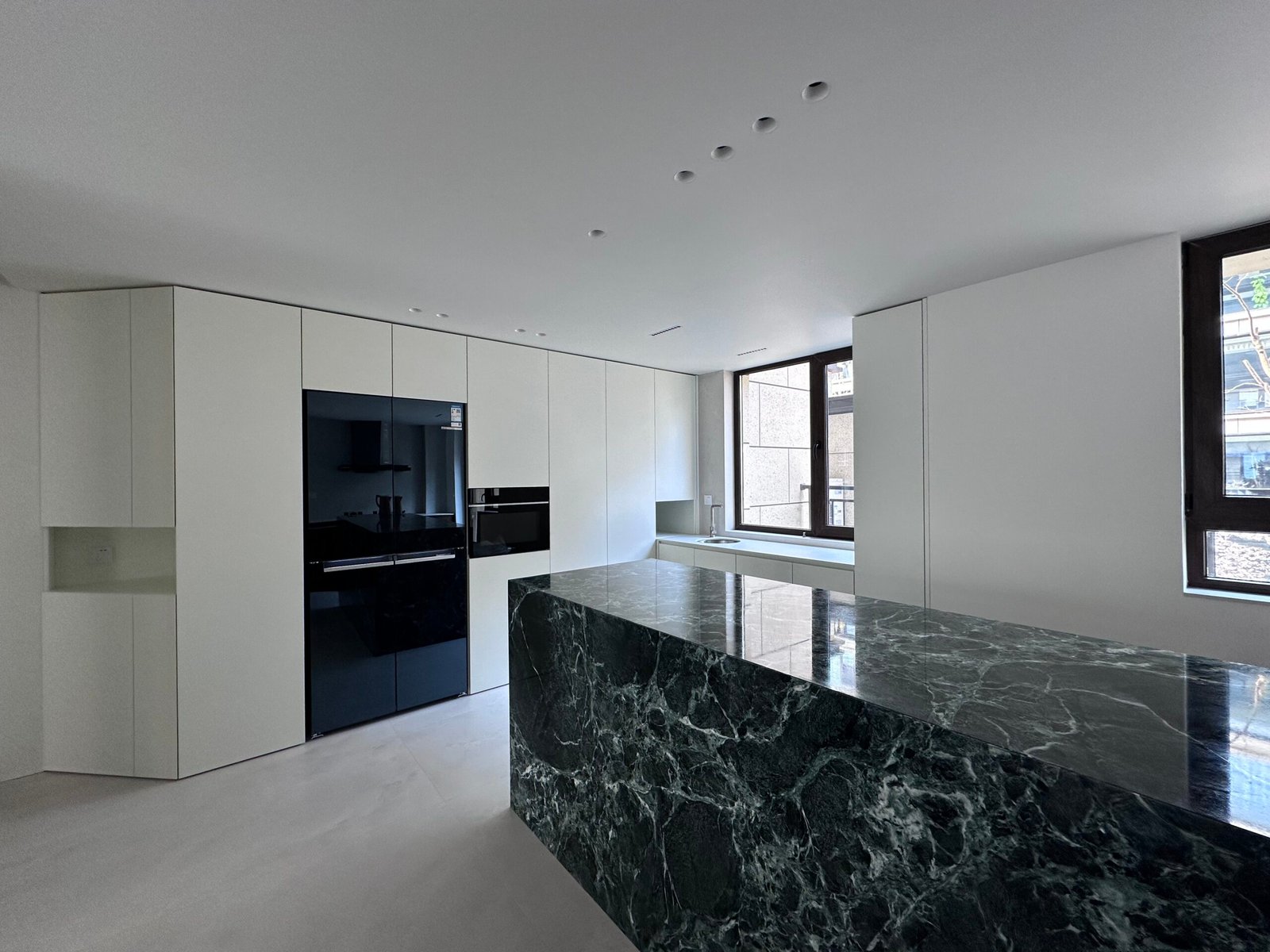 green-marble-kitchen-island-white-cabinet