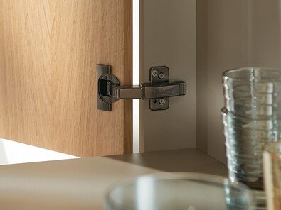 Concealed hinge installed on wood cabinet door