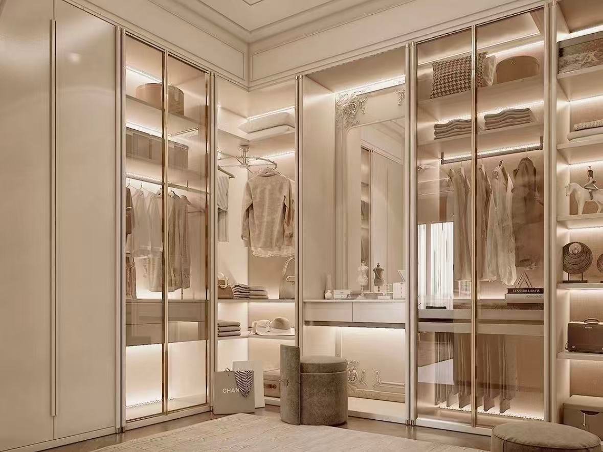 luxury beige walk in closet with glass wardrobe Beige wardrobe layout with warm LED lighting