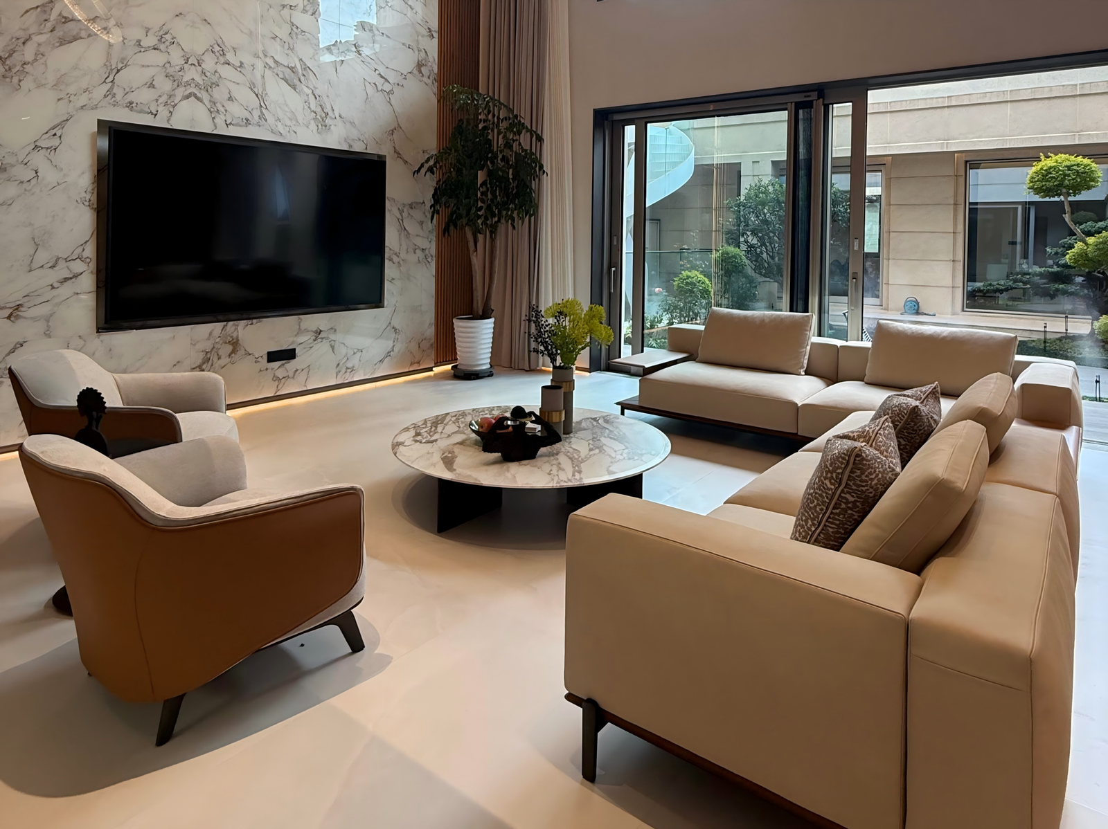 luxury-living-room-marble-tv-wall-garden-view