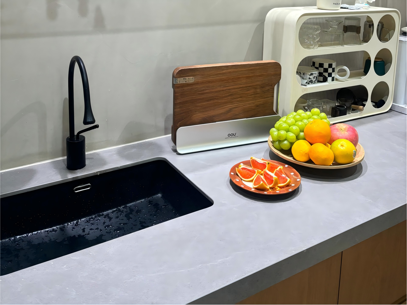 modern kitchen countertop with black sink and wood cabinets modern-kitchen-countertop-with-black-sink-and-wood-cabinets