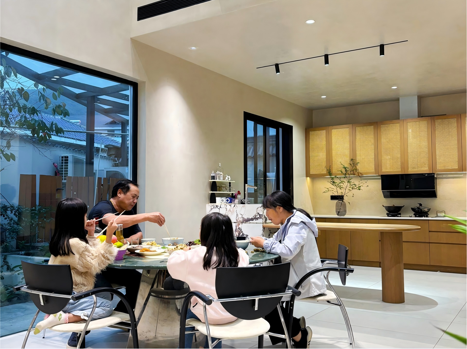 modern villa dining room with warm wood kitchen cabinets modern-villa-dining-room-with-warm-wood-kitchen-cabinets.