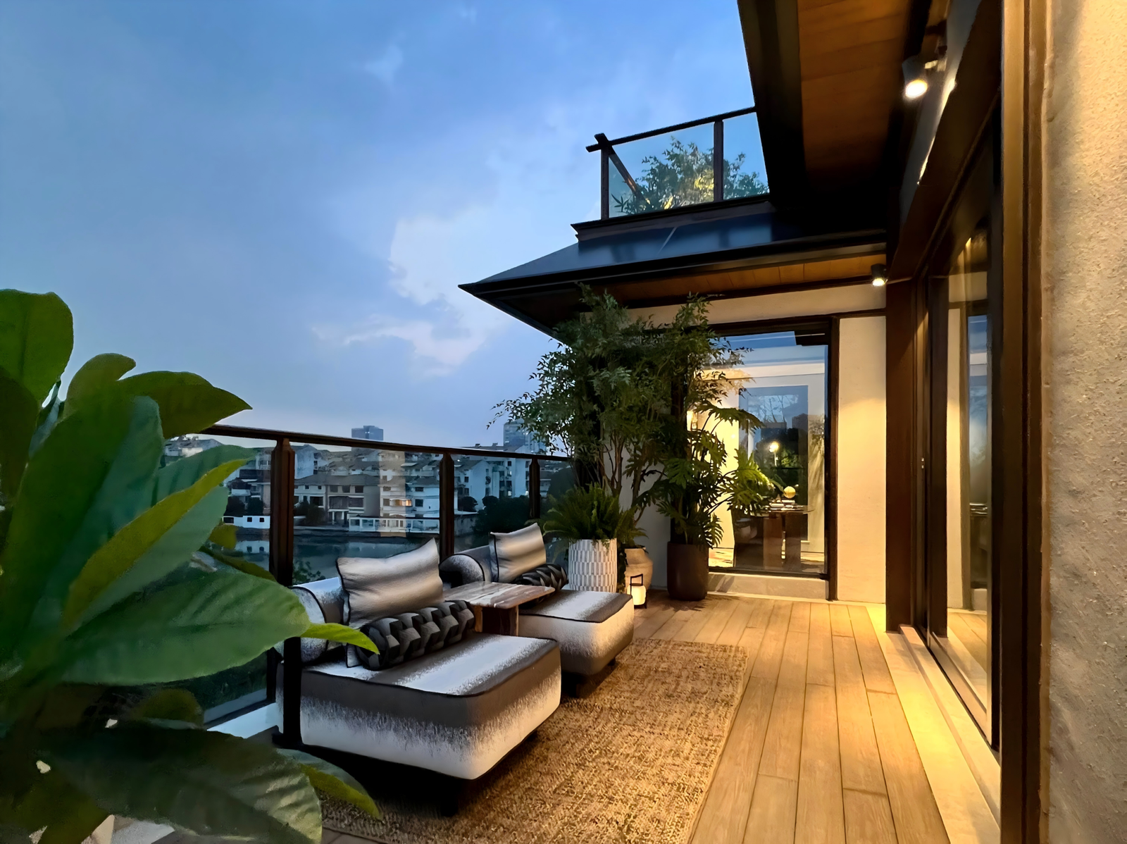 villa-balcony-lounge-with-outdoor-sofa-and-wood-flooring
