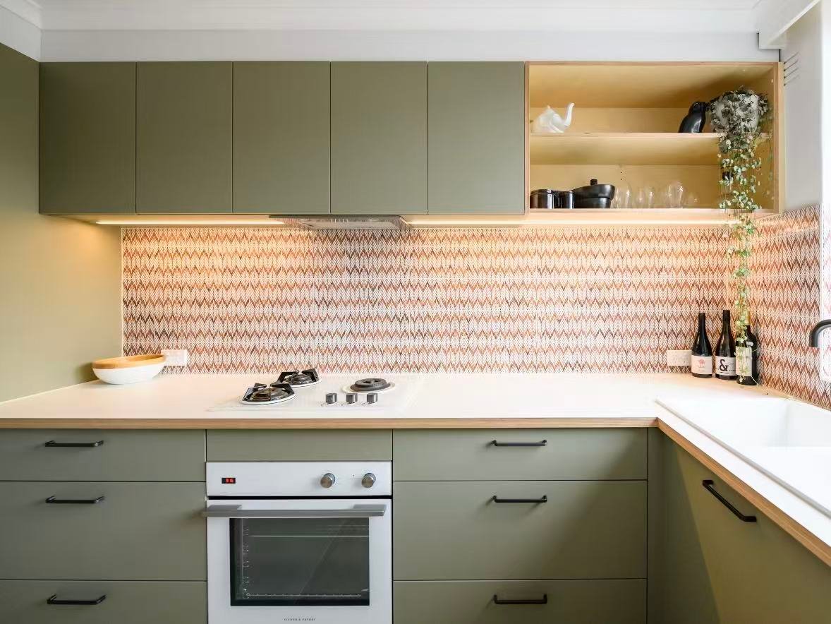 Apartment kitchen with space-saving custom cabinets