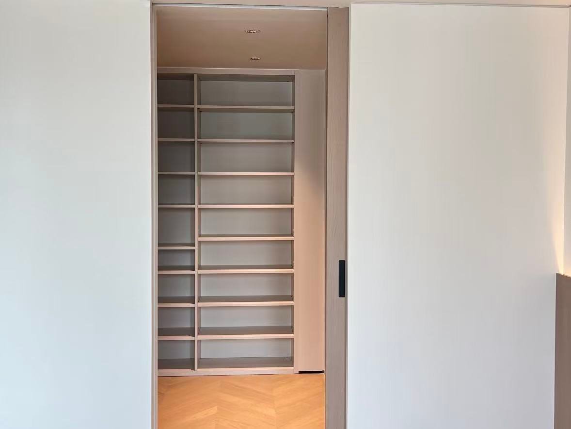 Floor-to-ceiling built-in wardrobe with open shelving