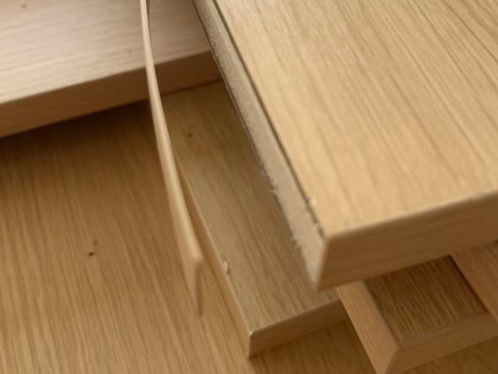 Peeling laminate cabinet edge near sink