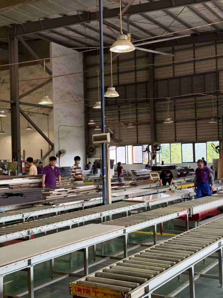 Automated cabinet panel conveyor production system