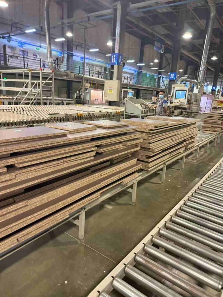 Cabinet manufacturing production line with panels