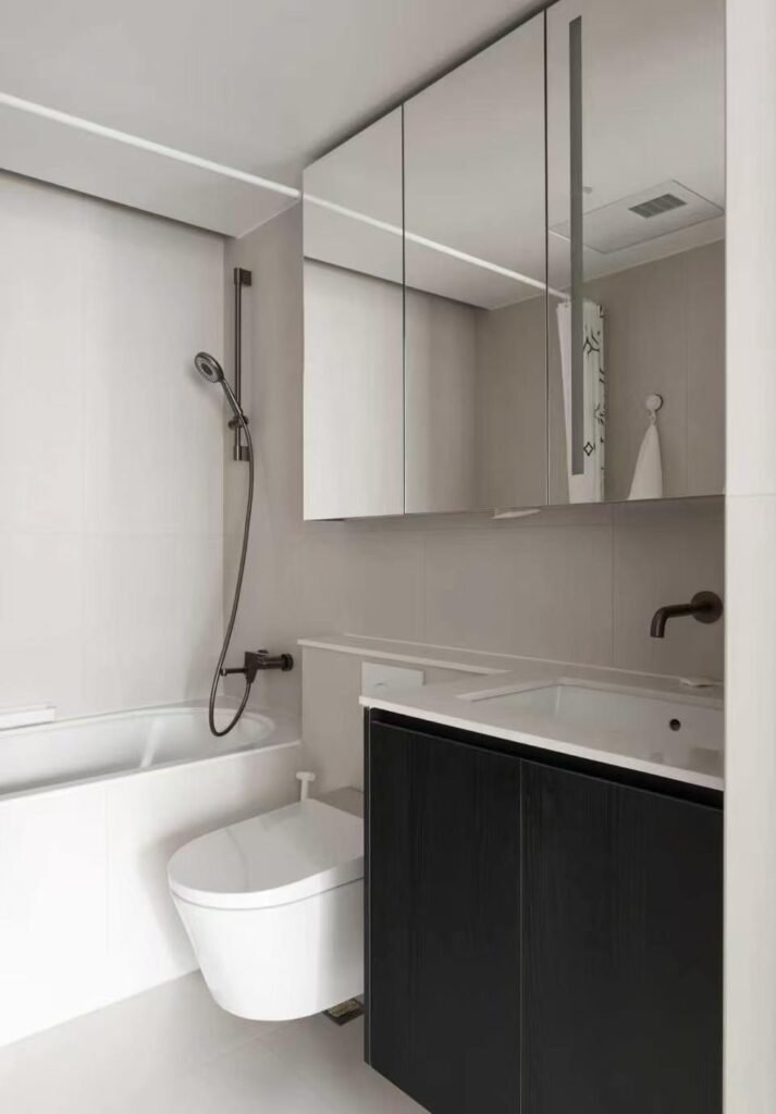 Compact apartment bathroom vanity with mirror storage