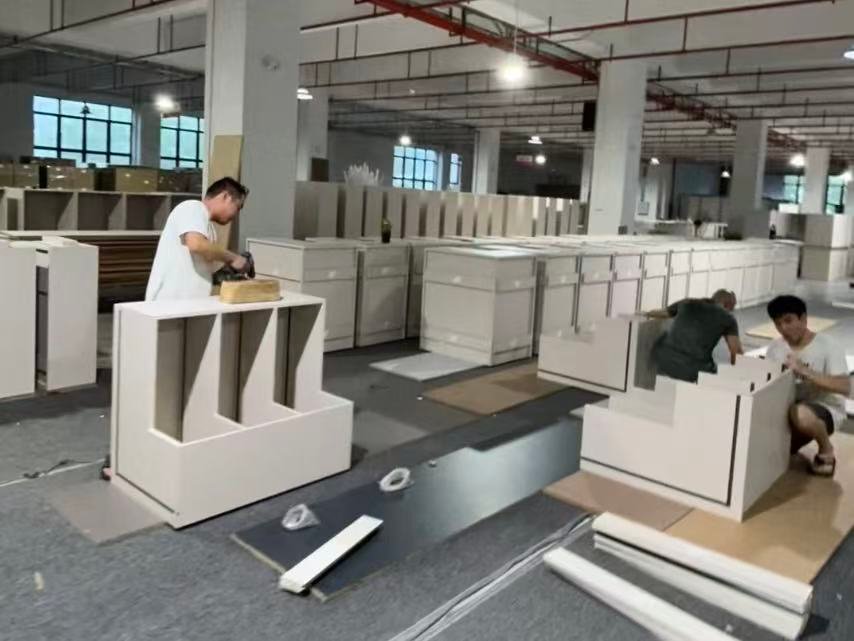 custom cabinet pre assembly quality check.jpg Custom cabinets undergoing pre-assembly quality inspection onsite