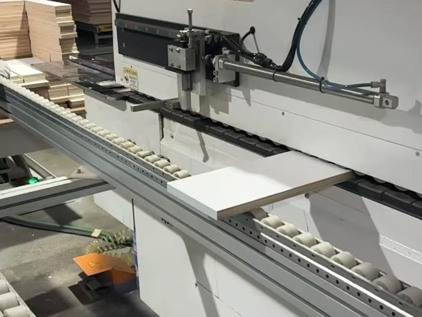 kitchen cabinet edge banding machine.jpg Cabinet panel processed by automatic edge bander