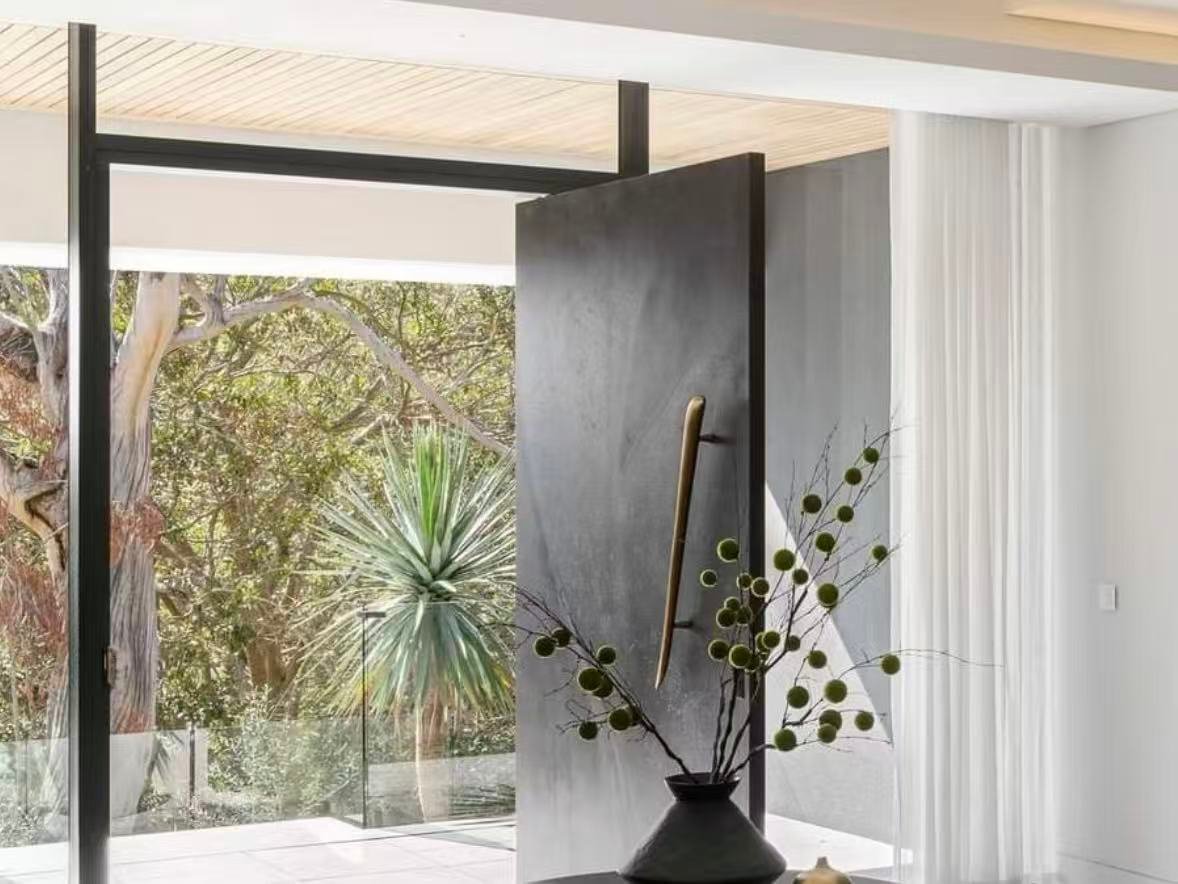 Custom pivot door for villa and architectural projects