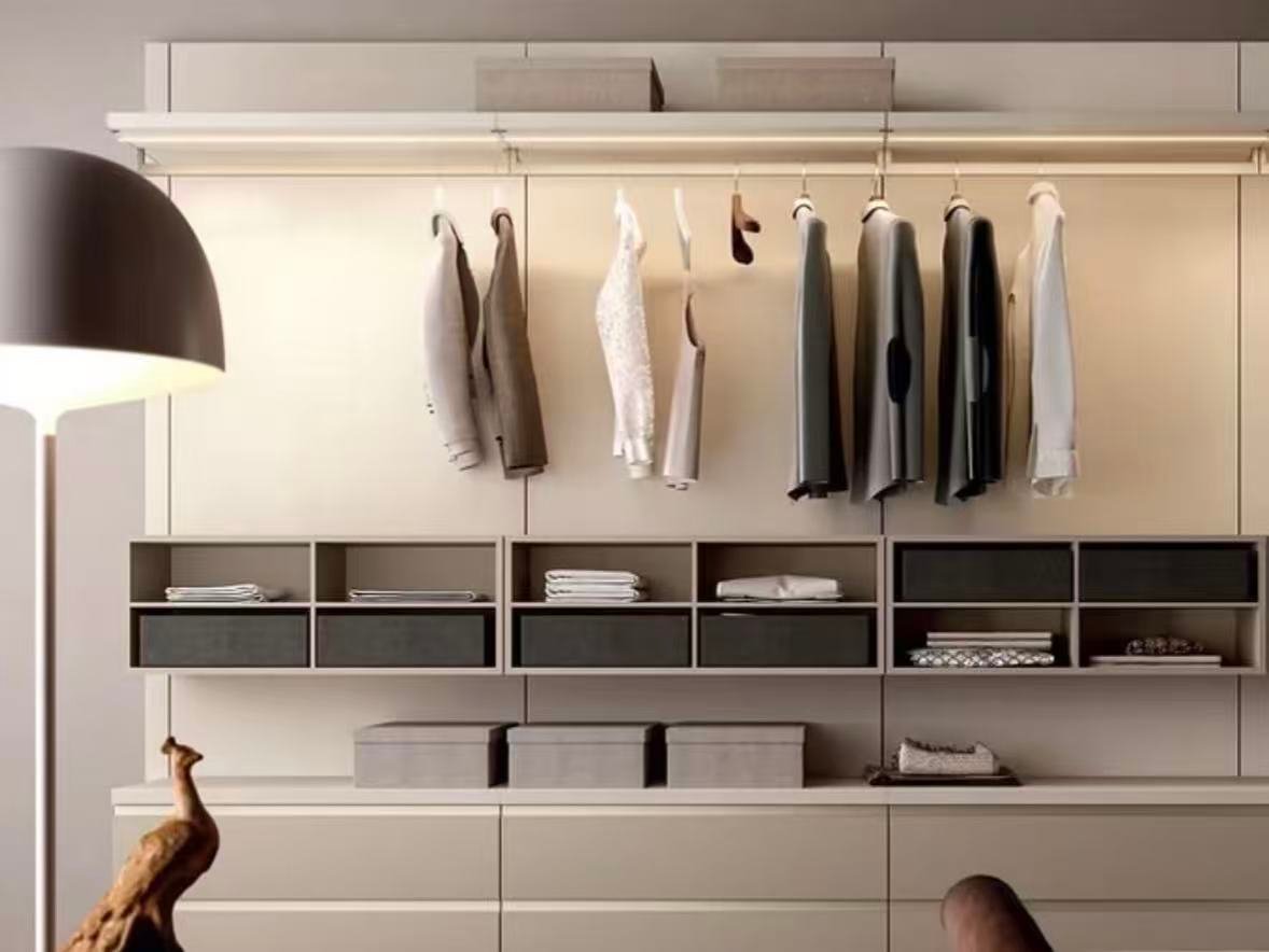 open wardrobe with storage shelves.webp Open wardrobe with shelves and clothing storage