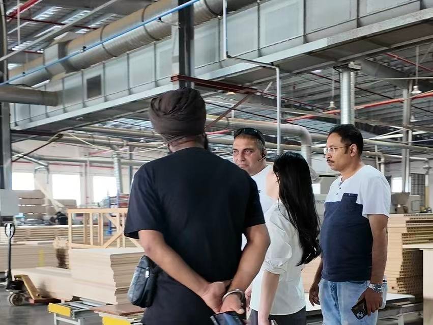 Overseas client inspecting hotel furniture production