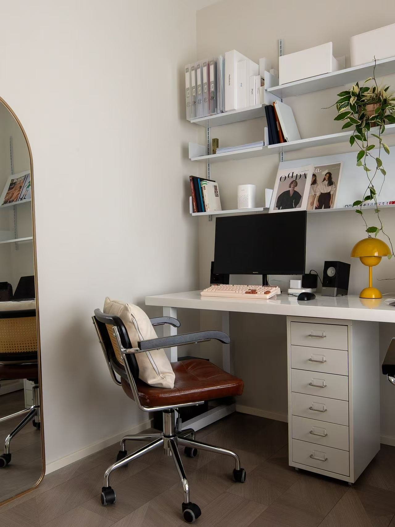 Small apartment home office with wall storage