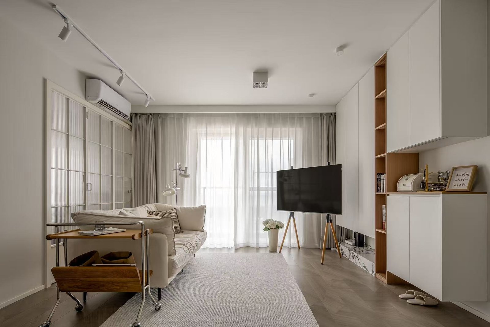 Integrated apartment living room storage wall