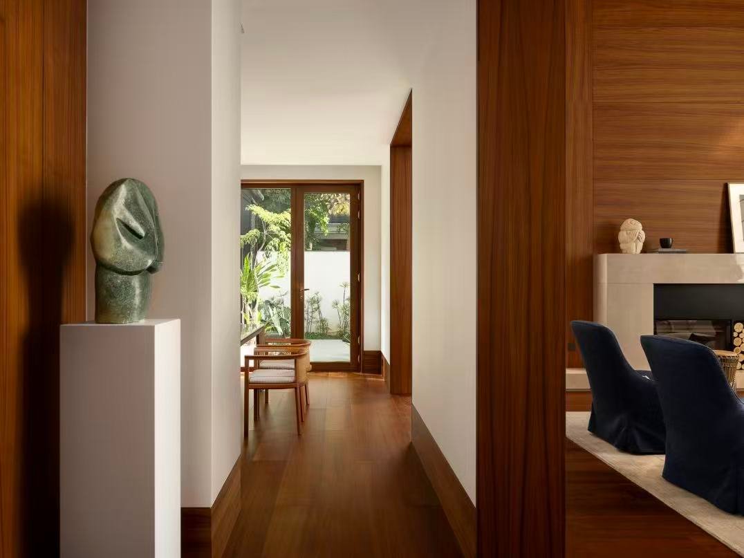 Villa hallway interior with custom wood panels