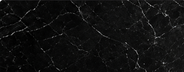 dark tone natural marble slab.png Dark natural marble slab with fine contrasting veining
