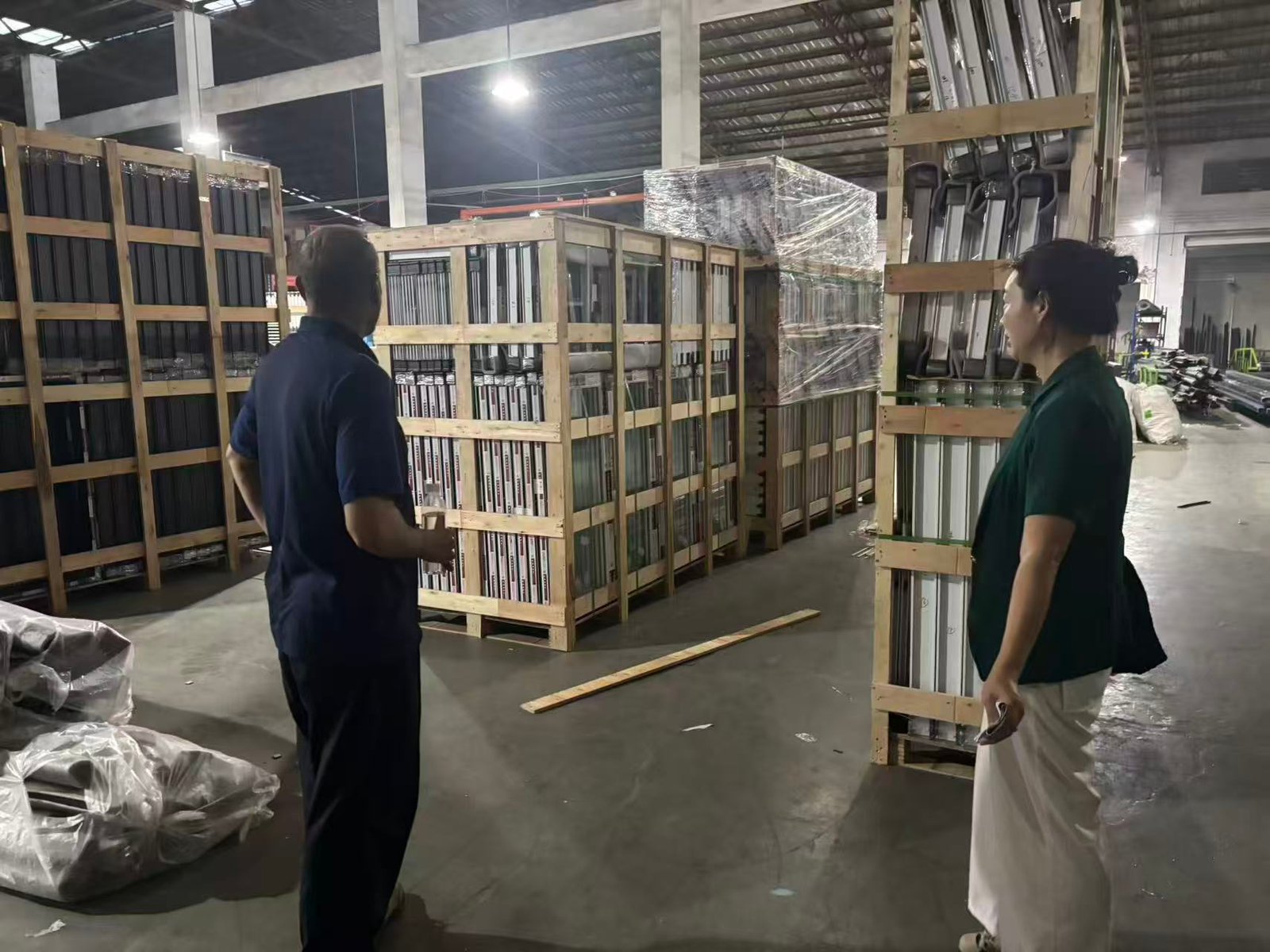 Client inspecting custom windows at factory