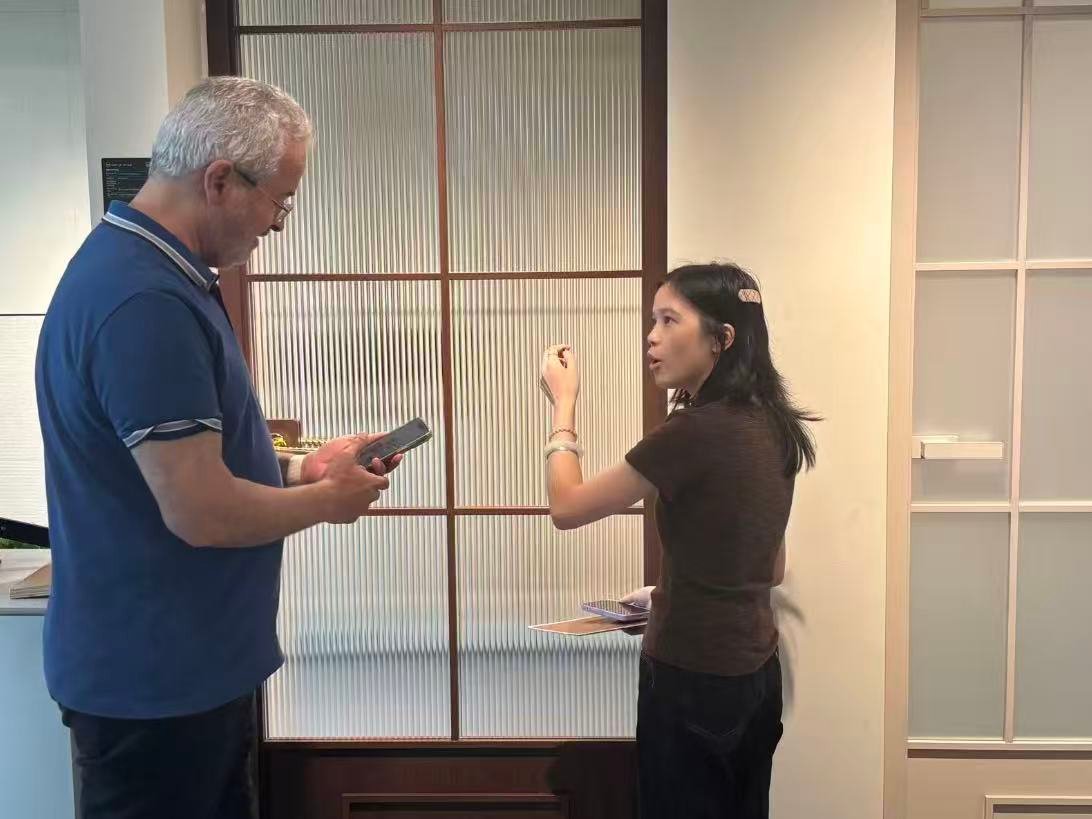 Project manager comparing showroom products with client