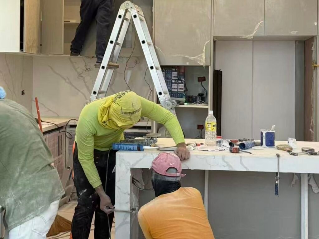 Villa custom kitchen with island during on-site installation